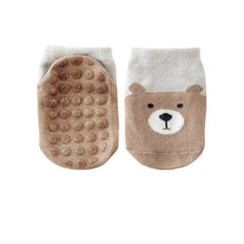 Load image into Gallery viewer, Tot and Toe Baby Grip Sock in Cool and breathable Zoo brown lion with full panel of grip across the sole, looks like yoga socks, low cut crew cut for warmer weather, great staying on power, gives balance and confidence and mimics barefoot walking benefits for toddlers learning to walk