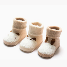 Load image into Gallery viewer, Picture of three pairs of terry lined folded cuff socks in a newborn size, all in neutral colours light brown, tan and cream with simple dainty animal outline.
