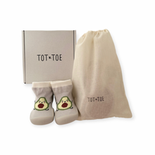 Load image into Gallery viewer, Light grey Sock Shoe with a happy dancing avocado (Sock with a BPA free silicone sole) for first walkers and toddlers with a cute dancing avocado, shoe box and a cotton drawstring bag containing mystery baby socks with grip, like yoga socks to assist anti-slip.