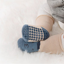 Load image into Gallery viewer, Tot and Toe baby premium anti-slip grip socks, yoga socks for learning to walk, cosy extra warm terry lined socks with blueberry and lemon print on the foot. Baby wearing blueberry cosy extra warm socks showing the full grip on sole.