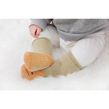 Load image into Gallery viewer, Tot and Toe baby premium anti-slip grip socks, yoga socks for learning to walk, cosy extra warm terry lined socks with green apple and orange print on the foot. Baby wearing cosy fruit orange socks showing the full sole grip.